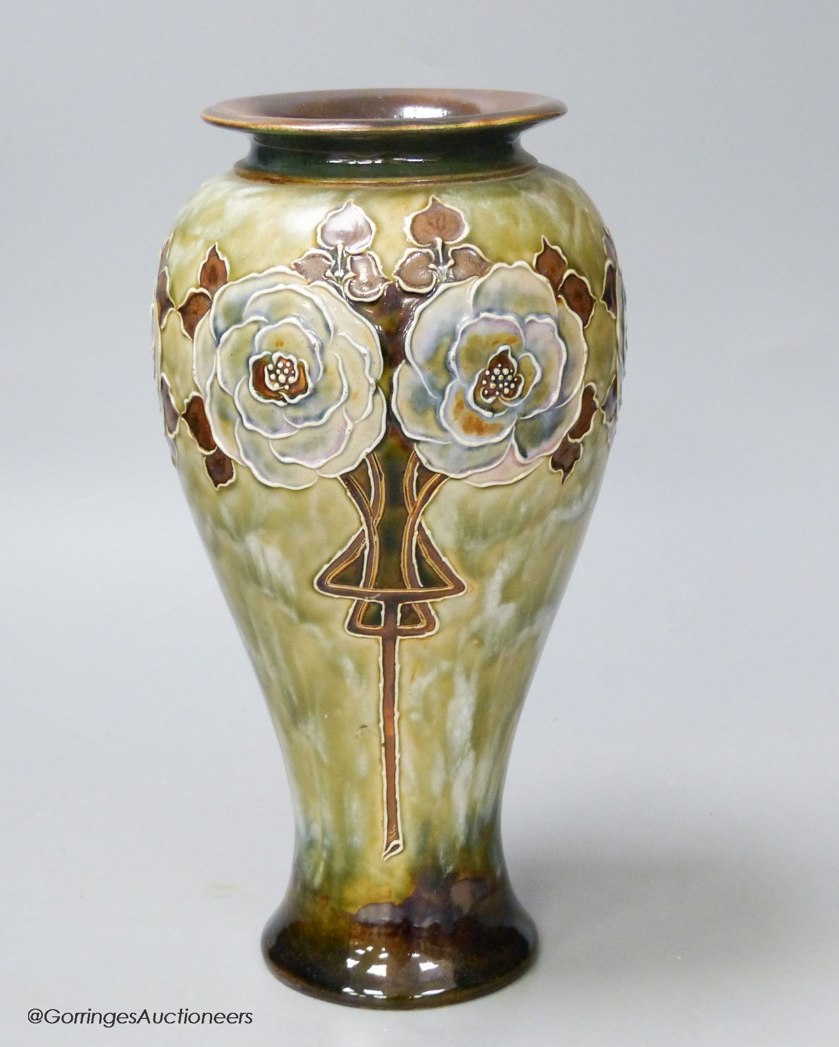 A Royal Doulton stoneware vase decorated with white roses by Eliza Simmance